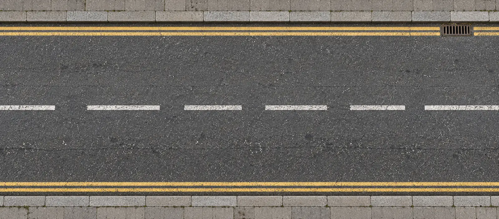 Before: worn, polished road surface with faded markings