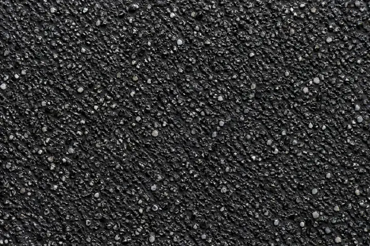 Close-up of black heavy-duty anti-skid surfacing in a loading bay