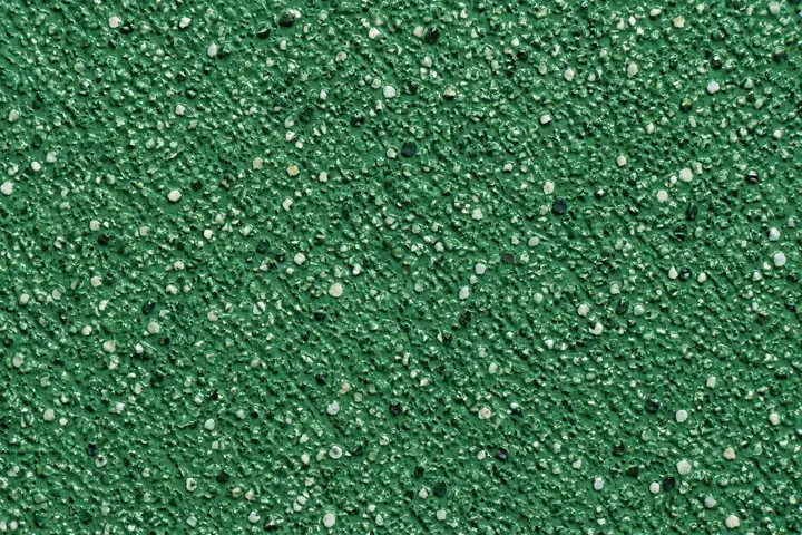 Close-up of green anti-slip coating on a walkway
